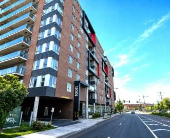 Immeuble d'appartements de brique rouge et beige, secteur Montréal-Nord